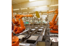 Robots working in an automation line